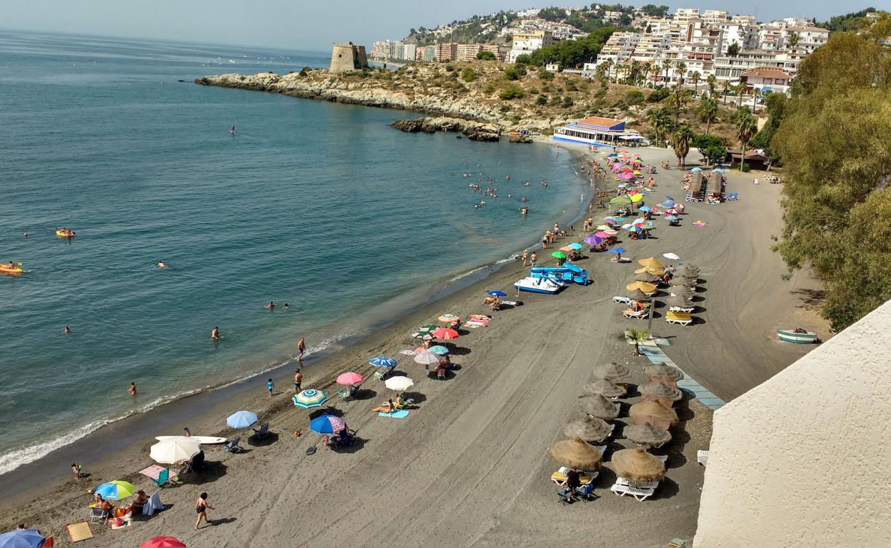 Photo of Playa del Pozuelo with gray sand &  pebble surface