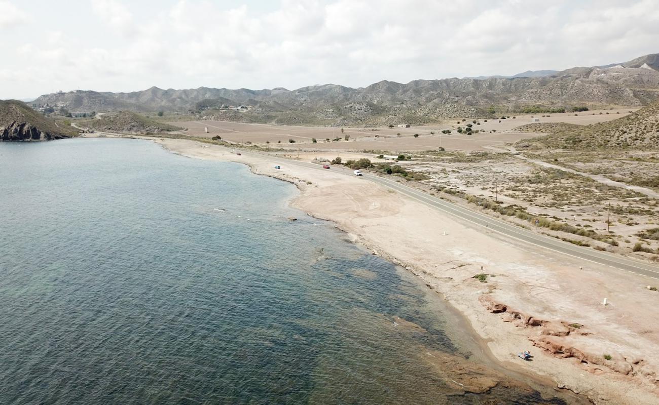 Photo of Playa de la Cola with gray shell sand surface