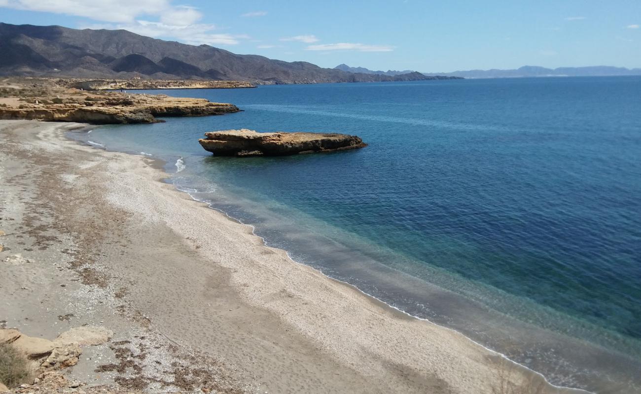 Photo of Playa de la Galera with gray shell sand surface