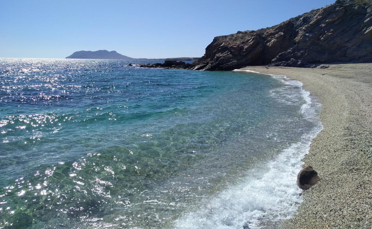 Photo of Cala Junquera with gray fine pebble surface