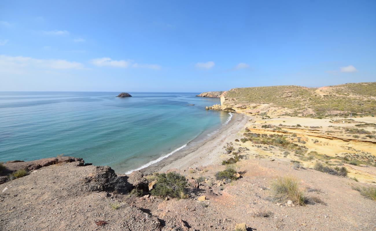 Photo of Playa Cueva de Lobos with brown sand &  rocks surface