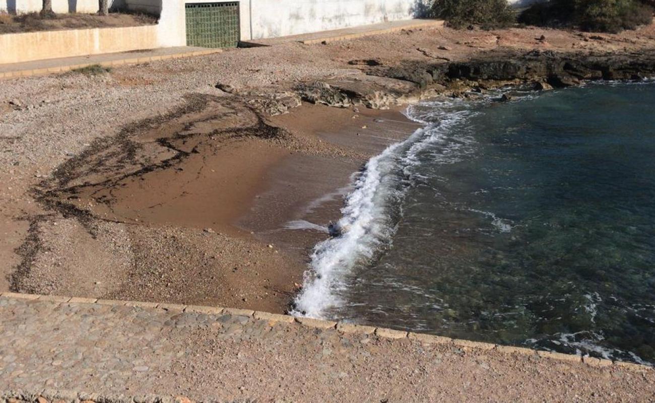 Photo of Cala Tobaco Beach with gray sand &  pebble surface