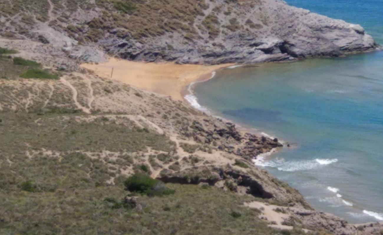 Photo of Cala de Huncos with brown sand surface