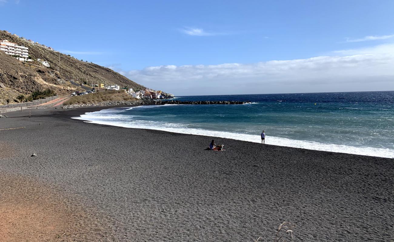 Photo of Playa de la Nea with gray sand surface