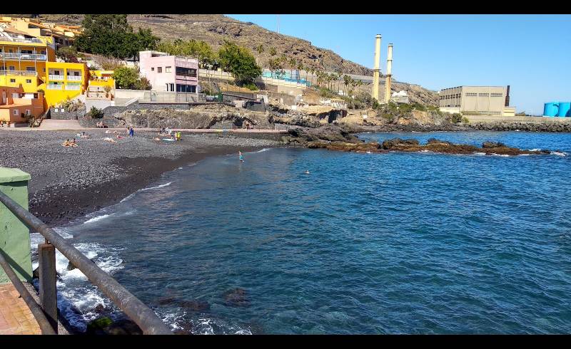 Photo of Playa Las Caletillas with gray sand &  pebble surface