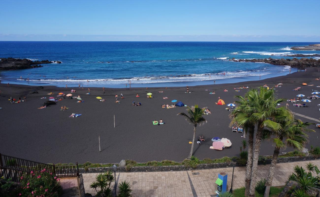 Photo of Beach of the Castle (Garden Beach) with gray fine sand surface