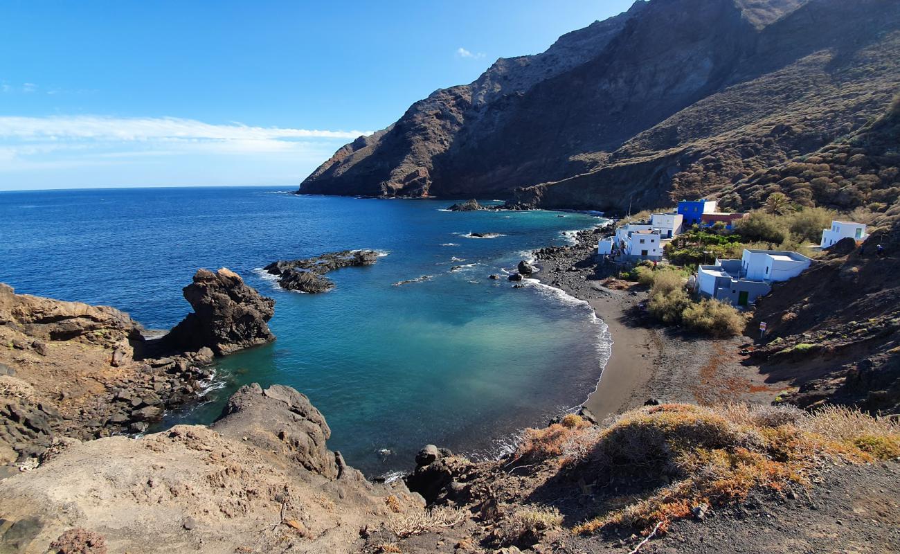 Photo of Playa Casas Blancas with gray sand surface