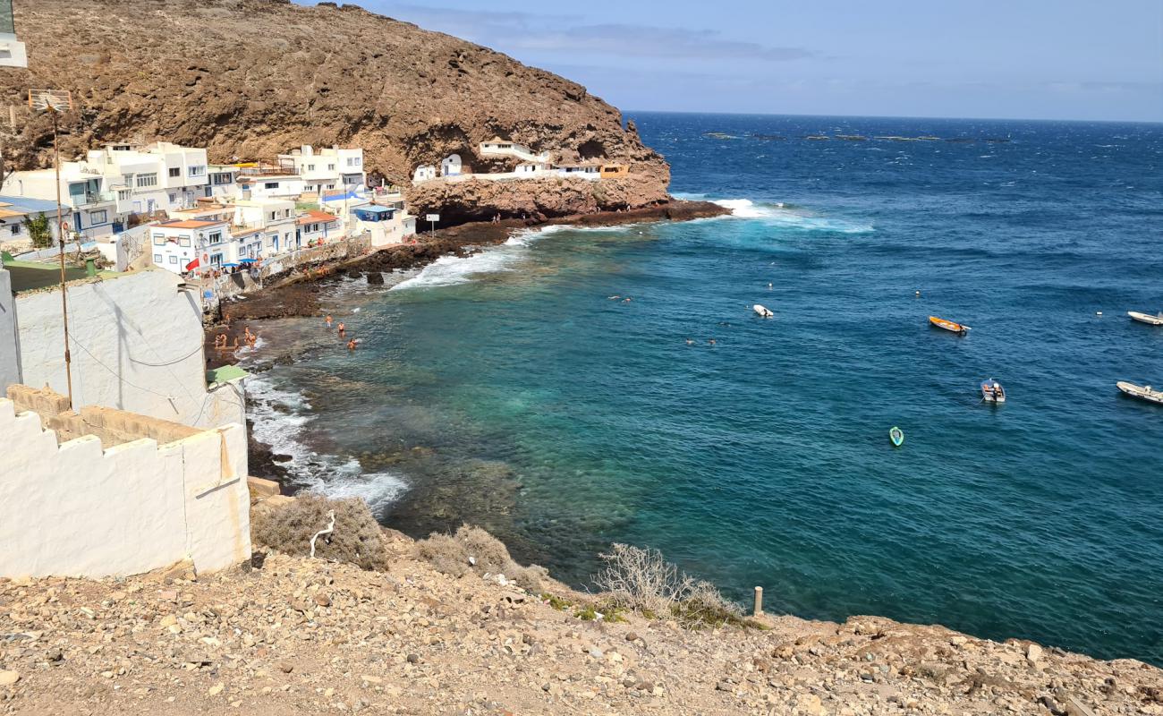 Photo of Tufia beach with rocks cover surface