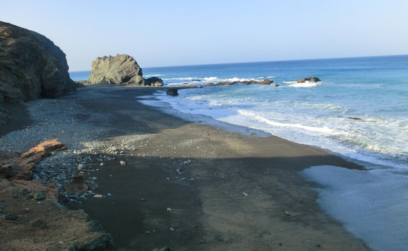 Photo of Amanay Beach with black sand surface