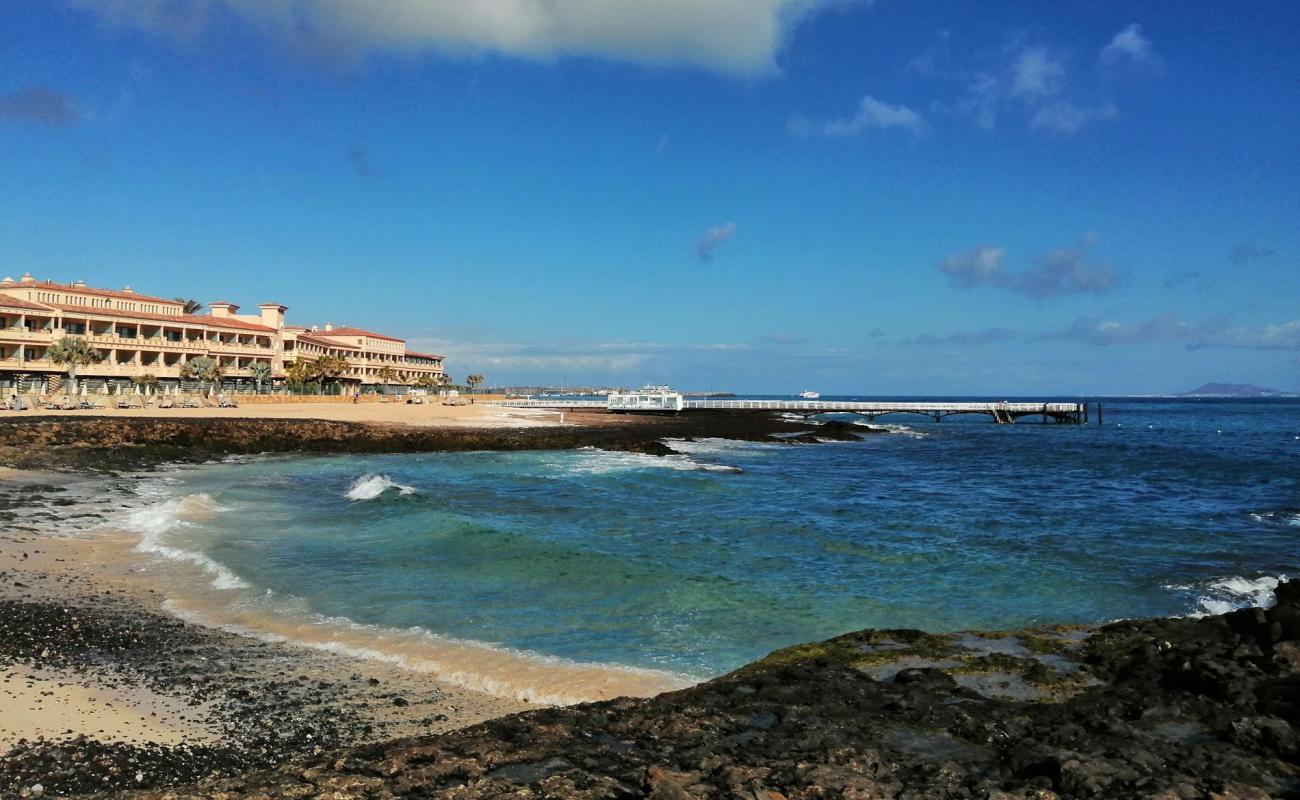 Photo of Playa Puerto Remedios with bright sand & rocks surface