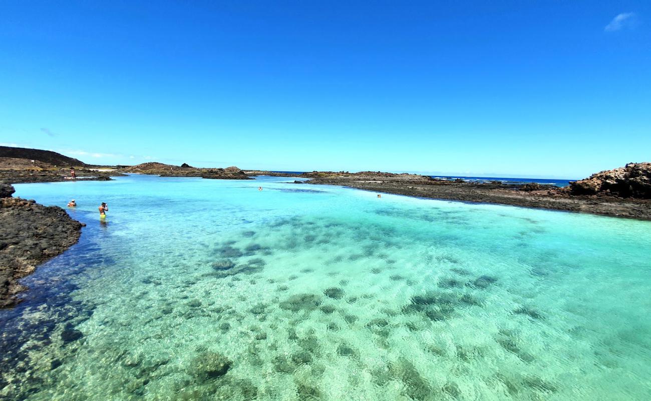 Photo of Puertito Isla De Lobos with bright sand & rocks surface