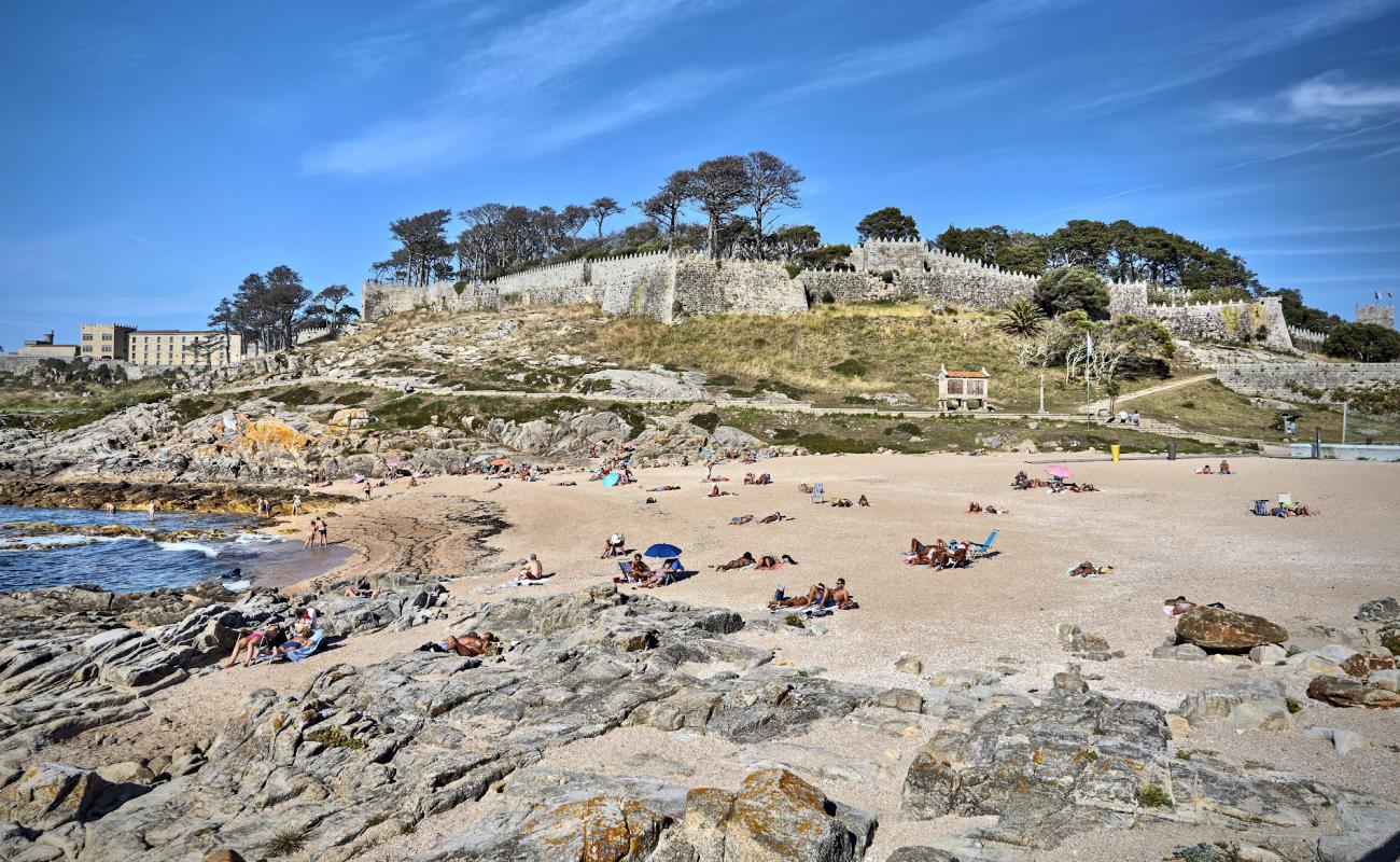 Photo of Praia da Cuncheira with bright sand & rocks surface