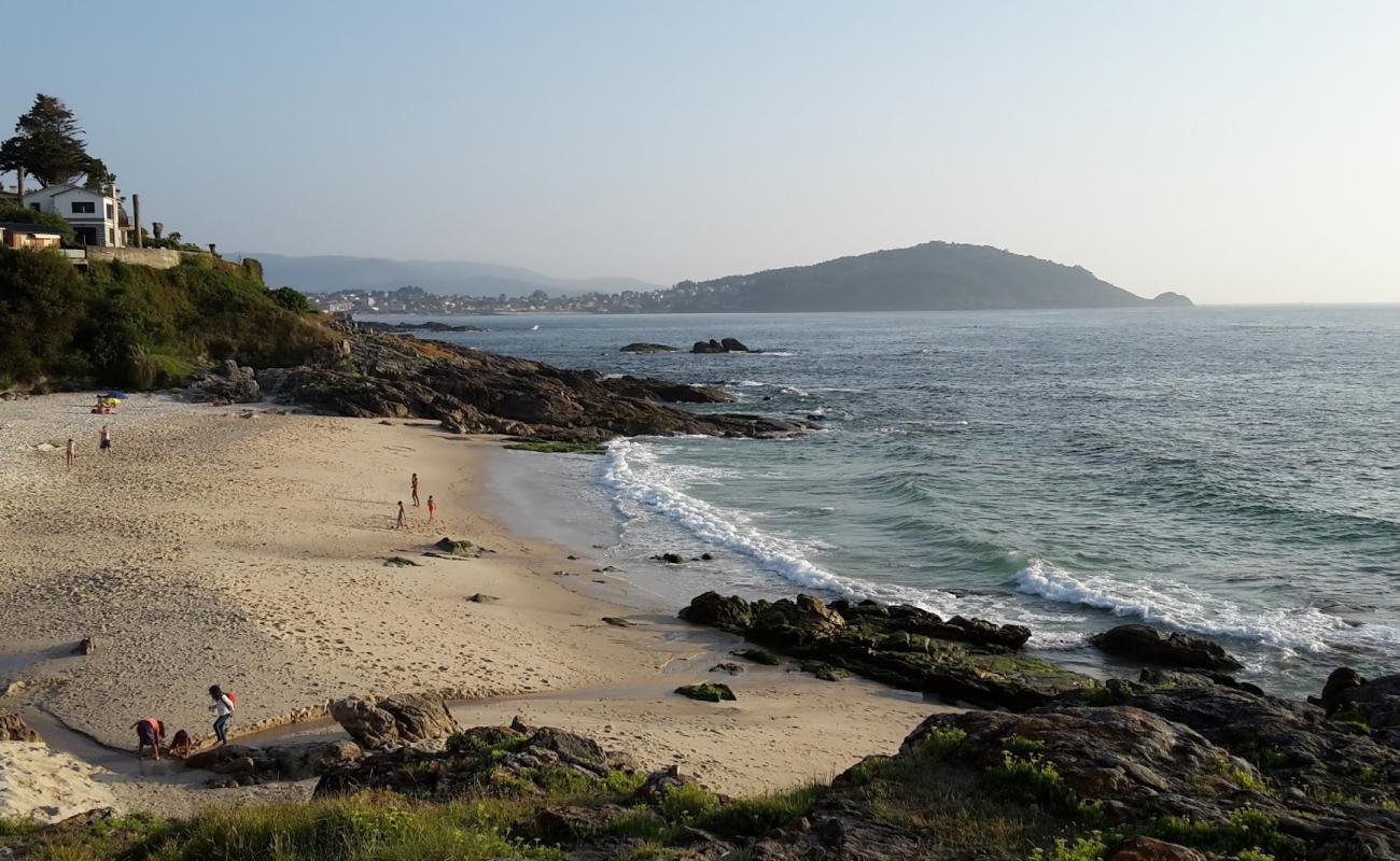 Photo of Praia dos Muinos with white sand surface