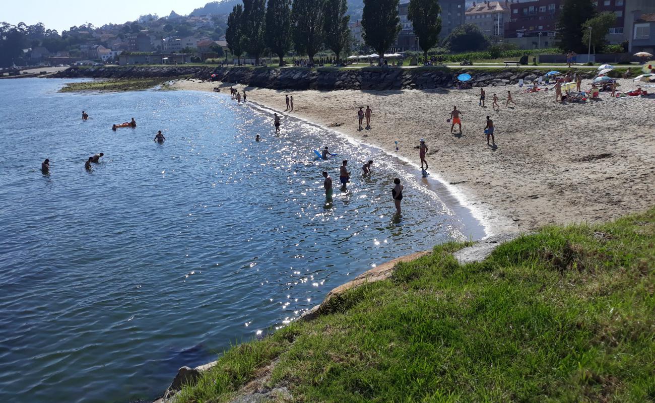 Photo of Praia da Tella with white sand surface