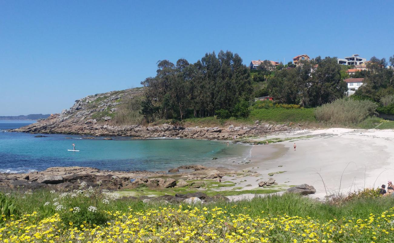 Photo of Praia de Areamilla with white sand surface