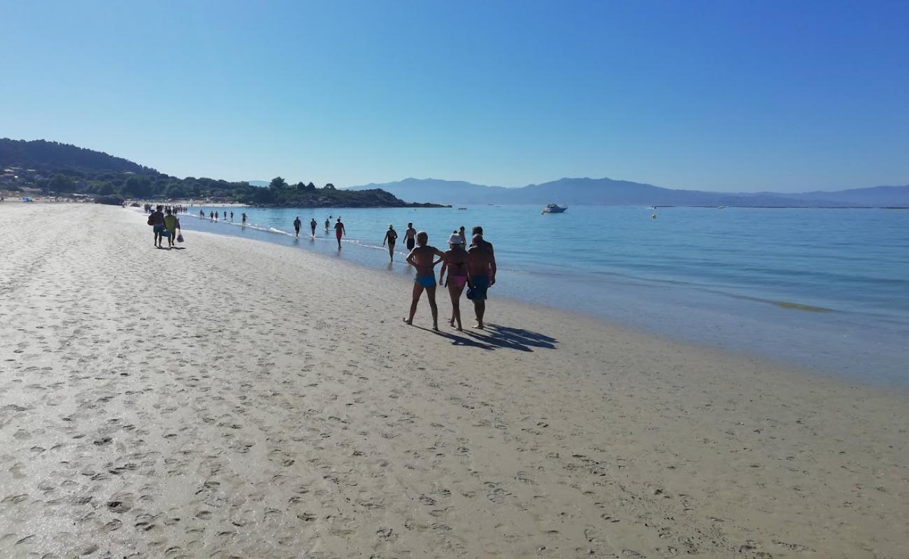 Photo of Playa de Nerga with white fine sand surface