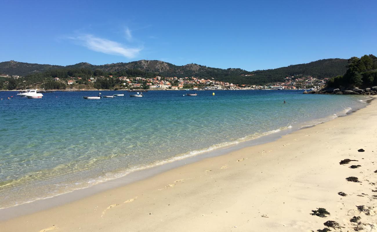 Photo of Praia Arneles with white sand surface