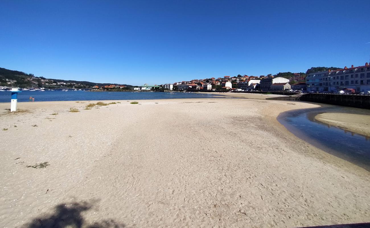 Photo of Praia de San Cibran with bright sand surface