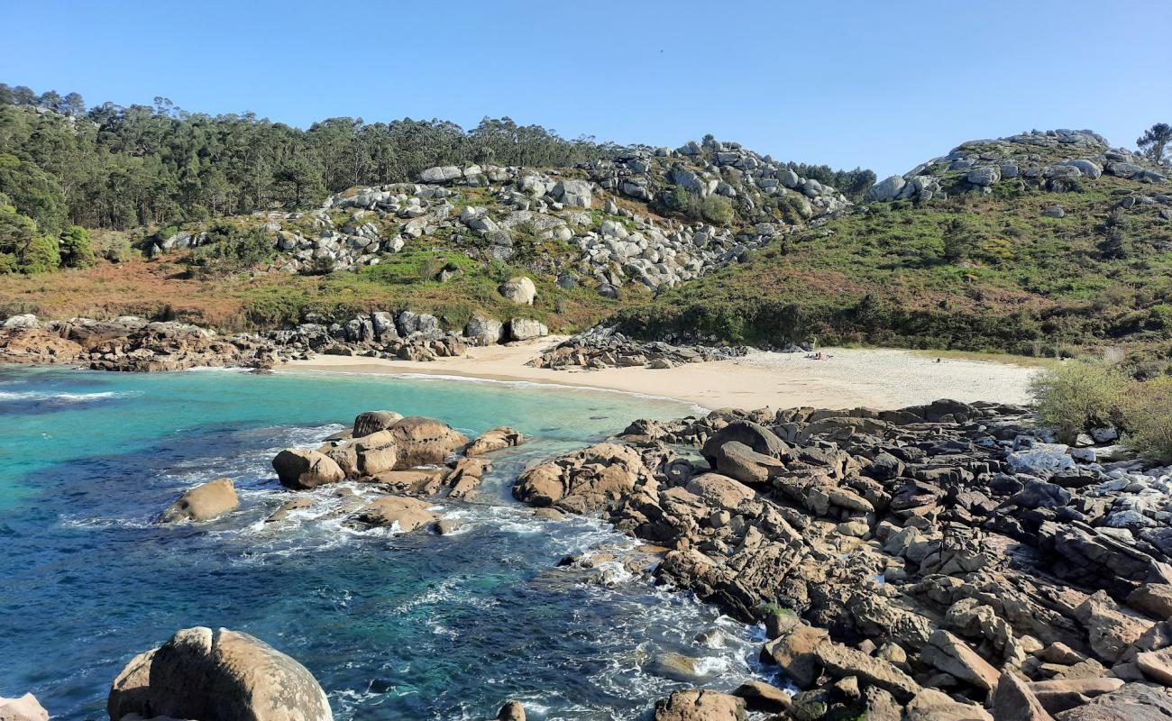 Photo of Praia da Lagoelas with white fine sand surface