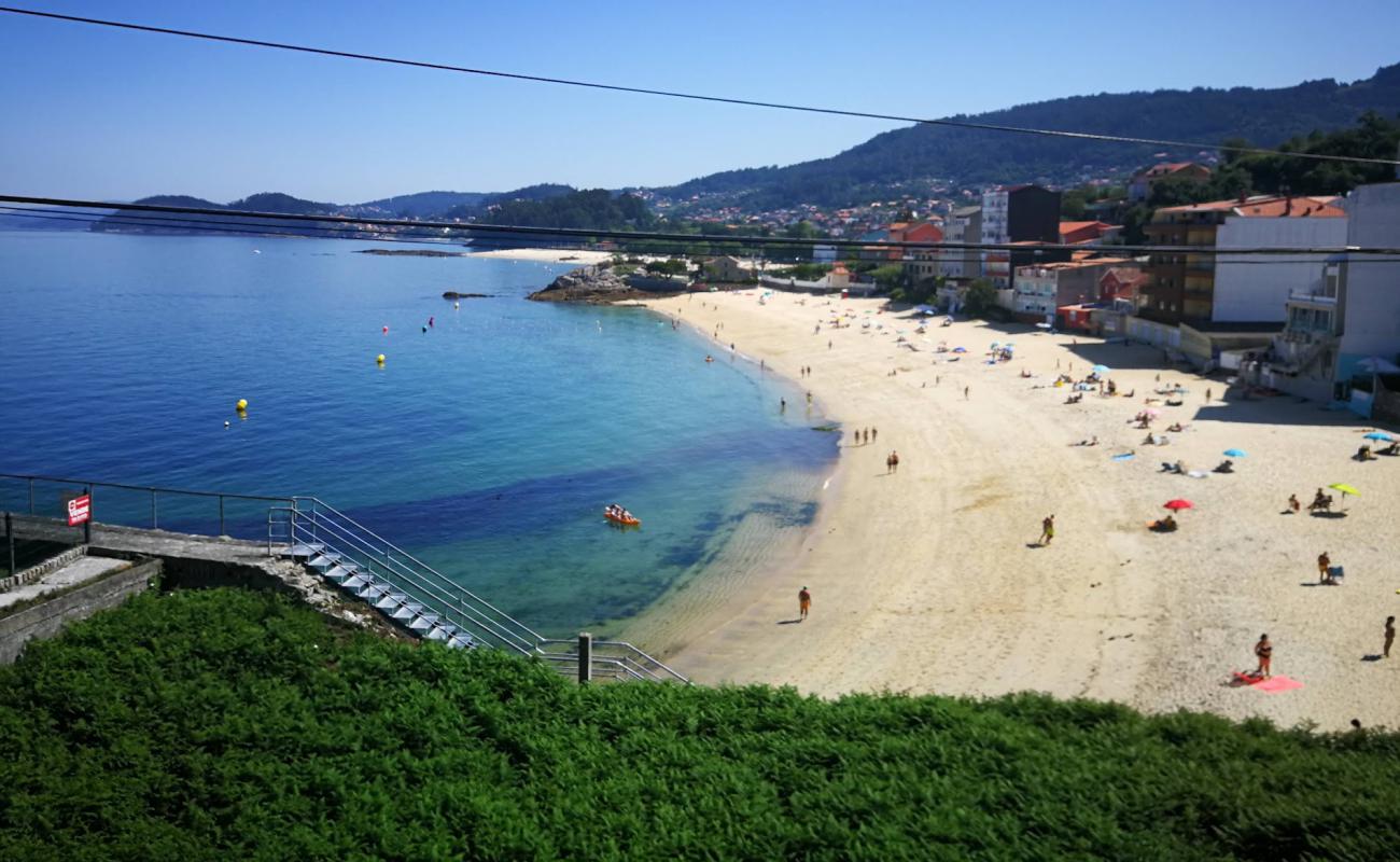 Photo of Praia de Agrelo with white sand surface