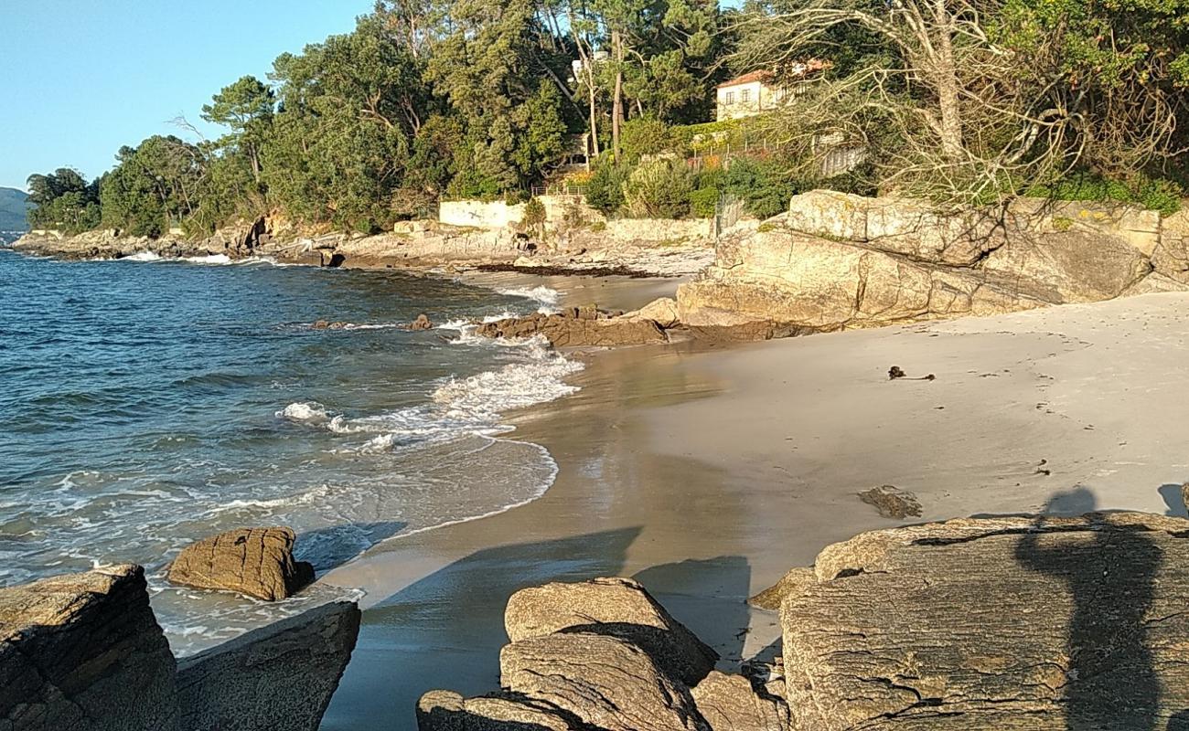 Photo of Praia dos Namorados with white fine sand surface