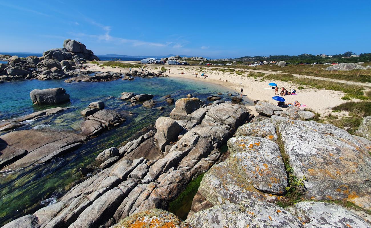 Photo of Praia do Con with bright sand surface