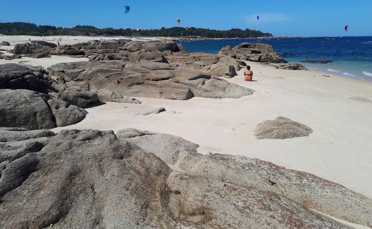 Photo of Mussel beach with white sand surface