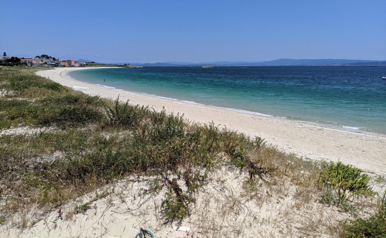 Photo of Castro beach with white sand surface