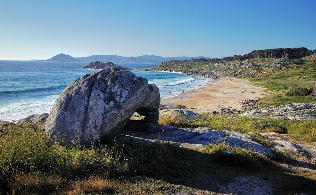 Photo of Praia do Castro de Barona with bright sand surface