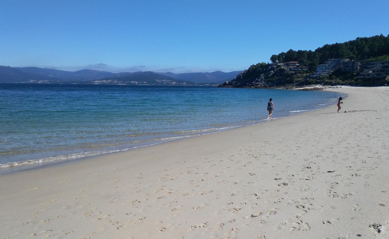 Photo of Caveiro beach with white fine sand surface