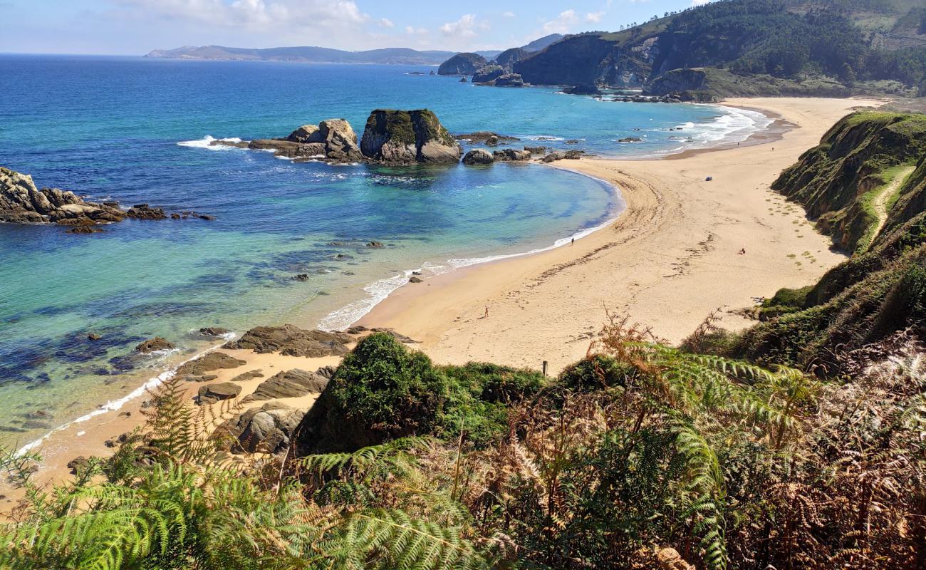 Photo of Praia de San Roman with white fine sand surface