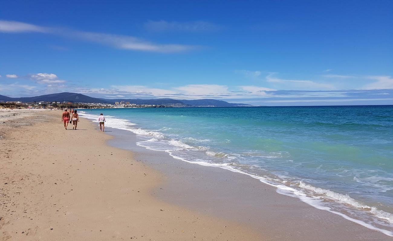 Photo of Praia de Coto with bright sand surface