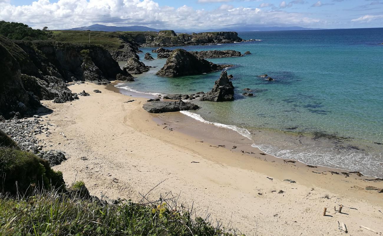 Photo of Playa de la Paloma with white fine sand surface