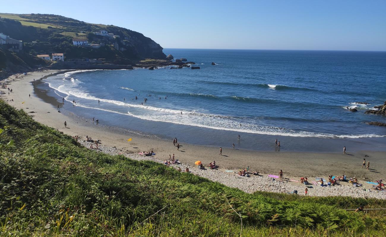 Photo of Playa de Arnao with light pebble surface