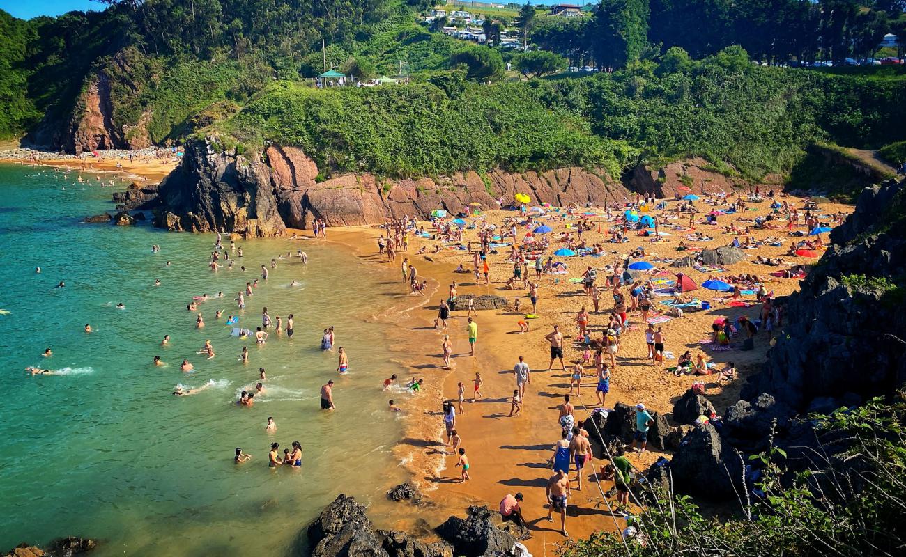 Photo of Playa Carranques with bright fine sand surface