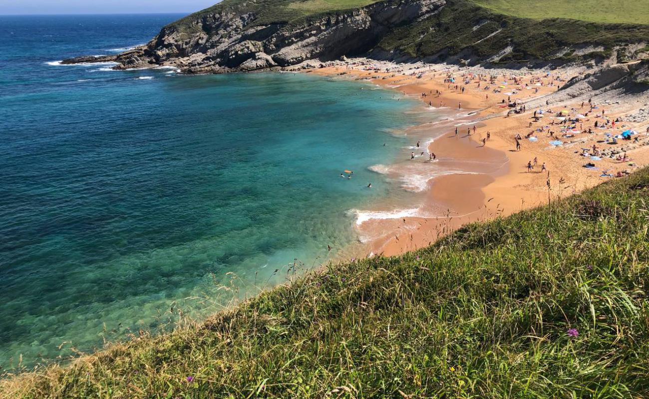 Photo of Playa de Tagle with bright sand surface