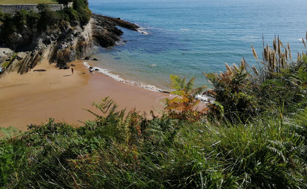 Photo of Playa de Los Molinucos with bright sand surface