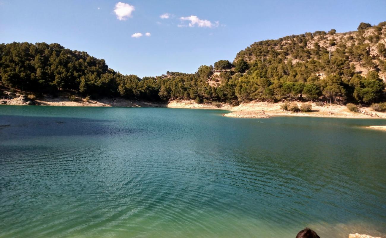 Photo of Playa del promontorio. with bright sand & rocks surface