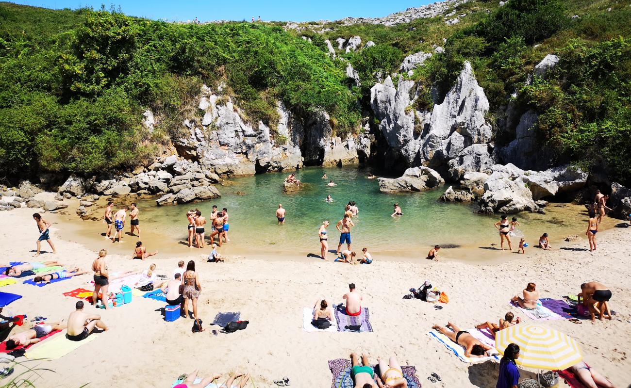 Photo of Gulpiyuri Beach with bright sand surface