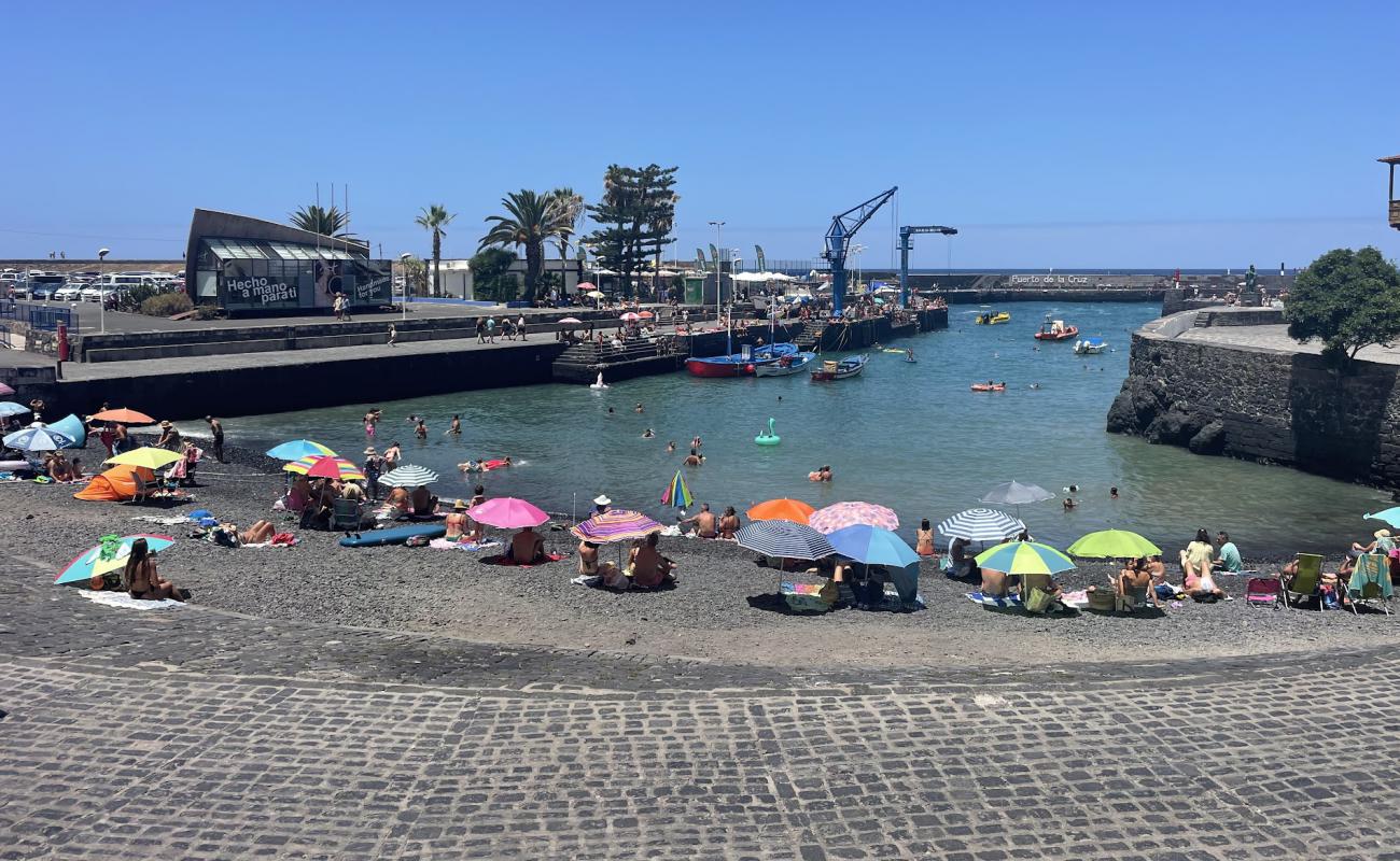 Photo of Playa del Muelle with gray pebble surface