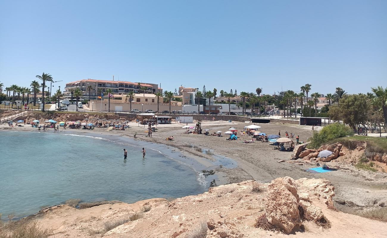 Photo of Playa de Cala Mosca with gray sand surface