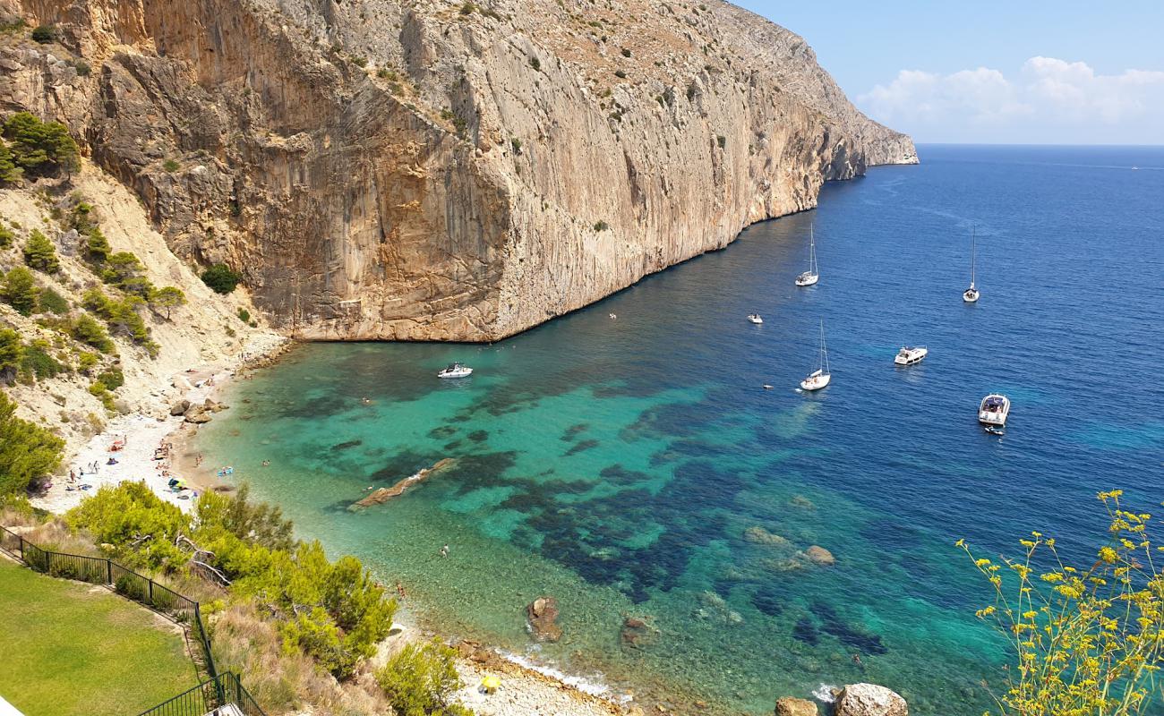 Photo of Cala del Raco del Corb with light pebble surface