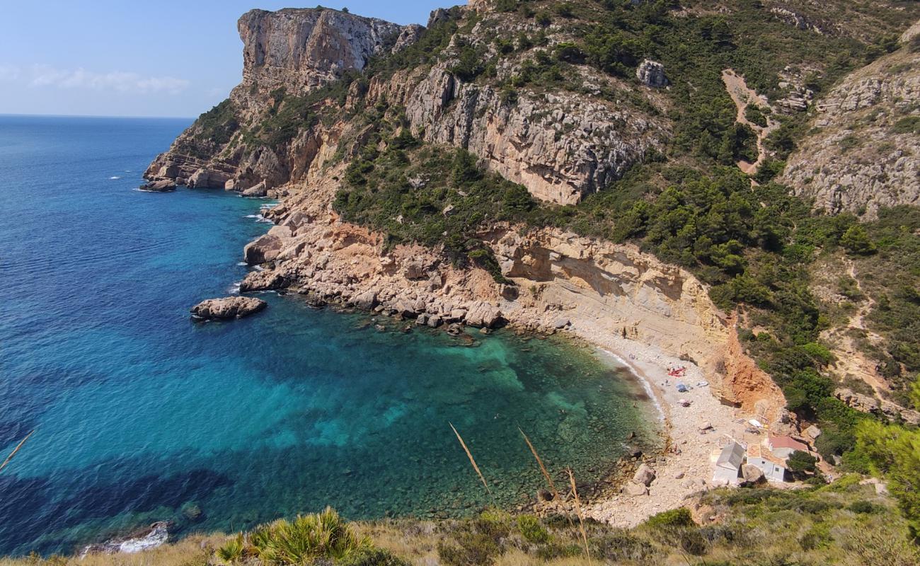 Photo of Cala Llebeig with rocks cover surface