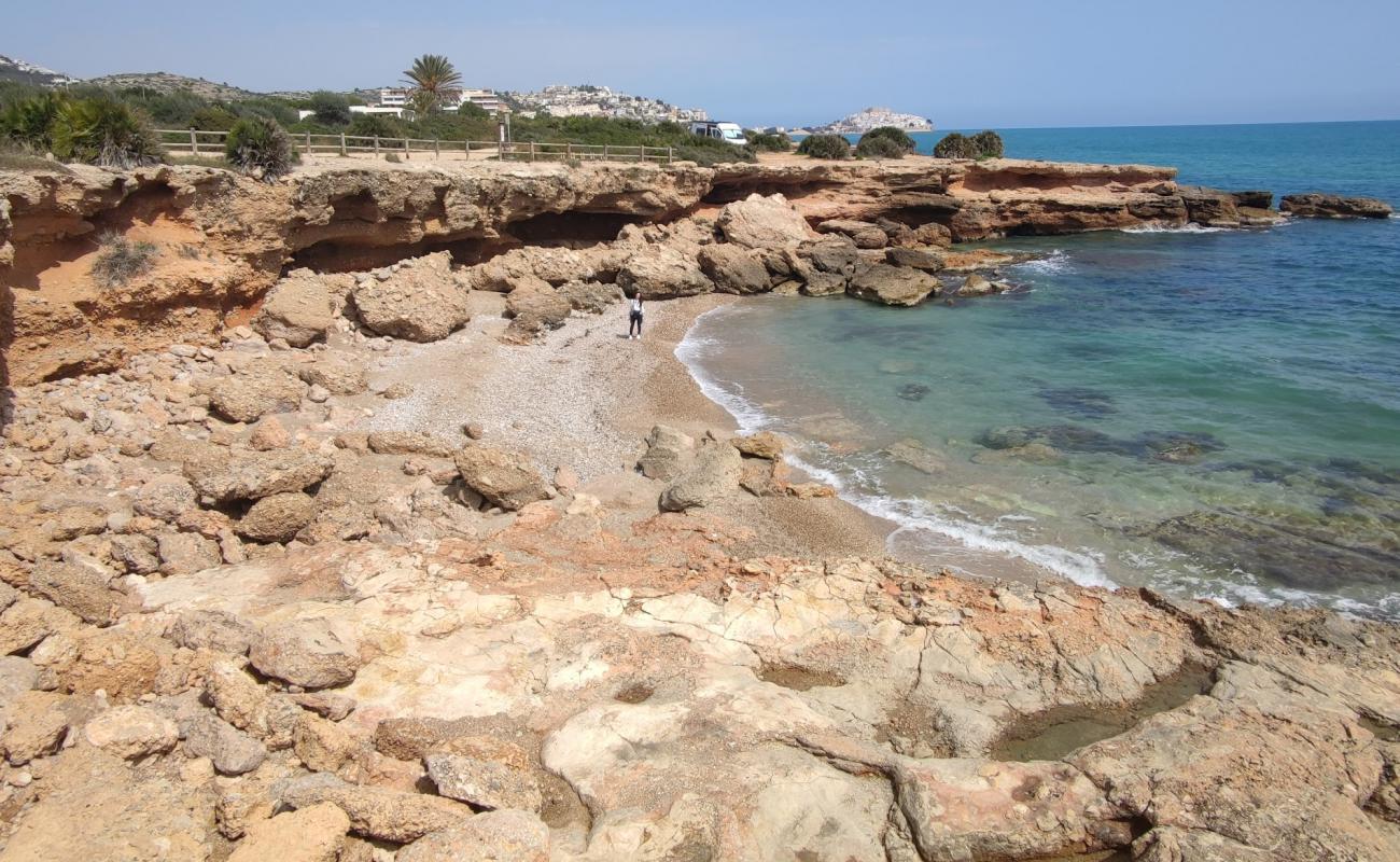 Photo of Cala Ordi with bright sand & rocks surface