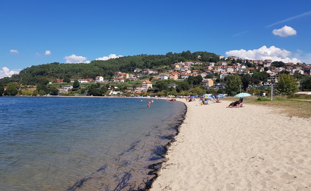 Photo of Praia de Cesantes with bright sand surface