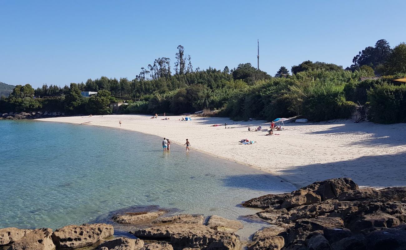 Photo of Praia de Pintens with bright sand surface