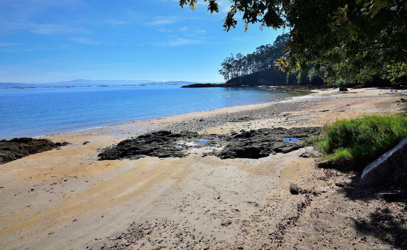 Photo of Praia Da Merce with bright sand & rocks surface