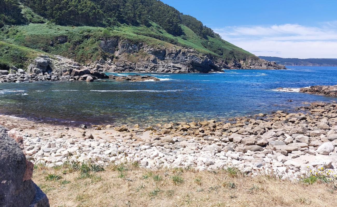 Photo of Praia de Portonovo with bright sand & rocks surface