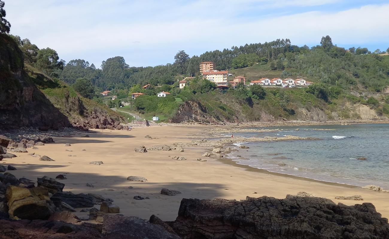 Photo of Playa de Lastres with bright sand & rocks surface