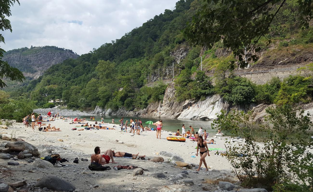 Photo of Spiaggia del Meriggio el Merisg with gray sand &  rocks surface